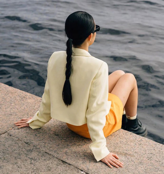 photo - girl looking across water